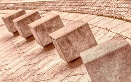What are the advantages of concrete blocks over bricks?