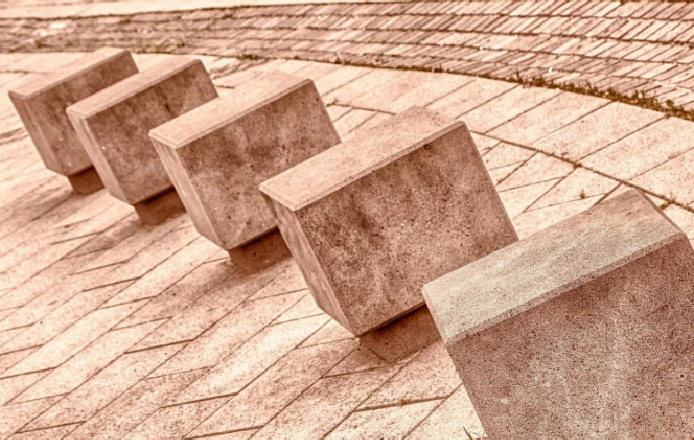 What are the advantages of concrete blocks over bricks?